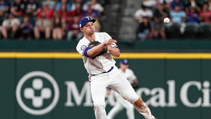 Jun 6, 2026; Arlington, Texas, USA; Texas Rangers shortstop Corey Seager (5) throws to first base against the Cleveland Guardians at Globe Life Field. Mandatory Credit: Dustin Safranek-Imagn Images