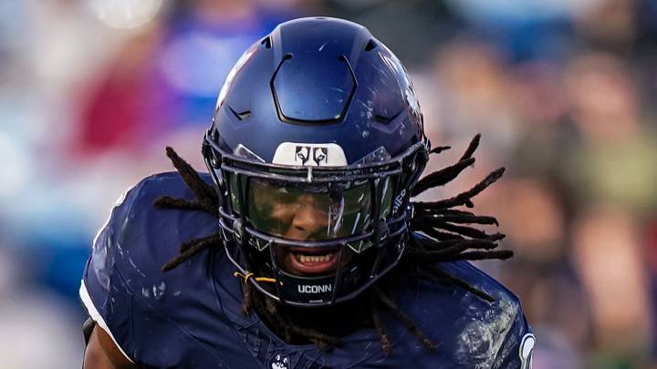 Nov 15, 2025; East Hartford, Connecticut, USA; UConn Huskies running back Cam Edwards (0) runs the ball against the Air Force Falcons in the second half at Pratt & Whitney Stadium at Rentschler Field. Mandatory Credit: David Butler II-Imagn Images