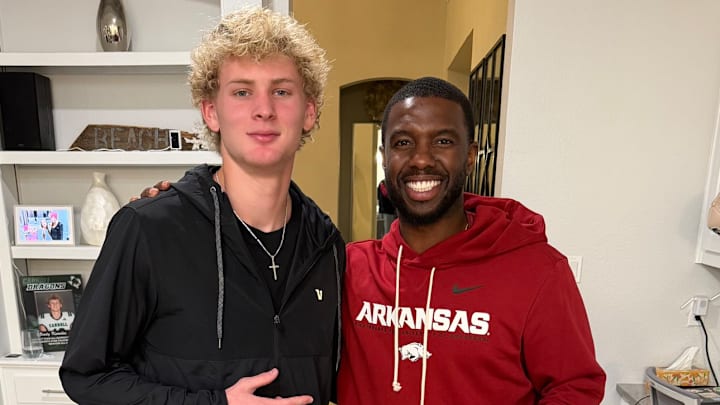Southlake Carroll wide receiver Brody Knowles with Arkansas Razorbacks wide receiver coach Larry Smith during an in-home recruiting visit in January. Southlake Carroll wide receiver Brody Knowles with Arkansas Razorbacks wide receiver coach Larry Smith during an in-home recruiting visit in January.
