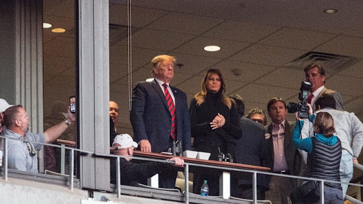 Fans take pictures of President Donald Trump at Bryant-Denny Stadium in Tuscaloosa, Ala., on Saturday, Nov. 9, 2019. 