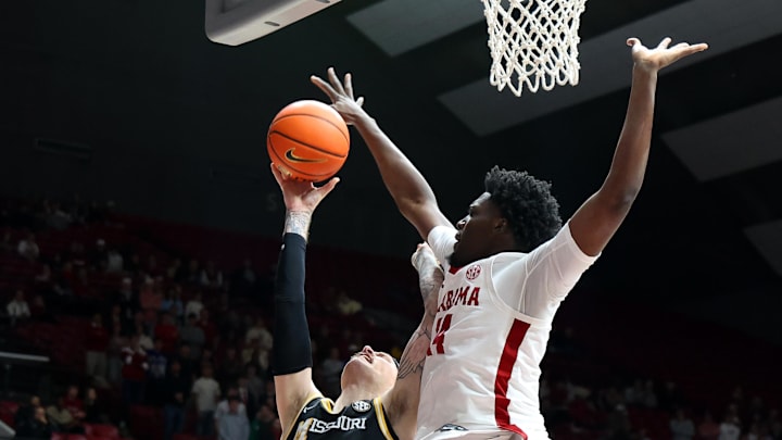 Jan 27, 2026; Tuscaloosa, Alabama, USA; Alabama Crimson Tide center Charles Bediako (14) guards Missouri Tigers guard Jacob Crews (35) during the first half at Coleman Coliseum. Mandatory Credit: David Leong-Imagn Images