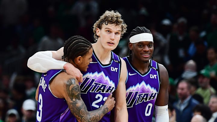Nov 3, 2025; Boston, Massachusetts, USA; Utah Jazz guard Keyonte George (3), forward Lauri Markkanen (23), and forward Taylor Hendricks (0) react during the second half against the Boston Celtics at TD Garden. Mandatory Credit: Bob DeChiara-Imagn Images