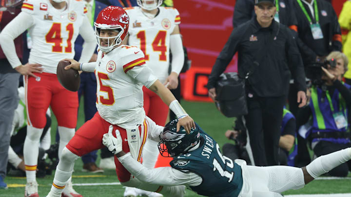 Kansas City Chiefs quarterback Patrick Mahomes is tackled by Philadelphia Eagles linebacker Josh Sweat (19) in the second half in Super Bowl LIX between the Philadelphia Eagles and the Kansas City Chiefs at Ceasars Superdome.