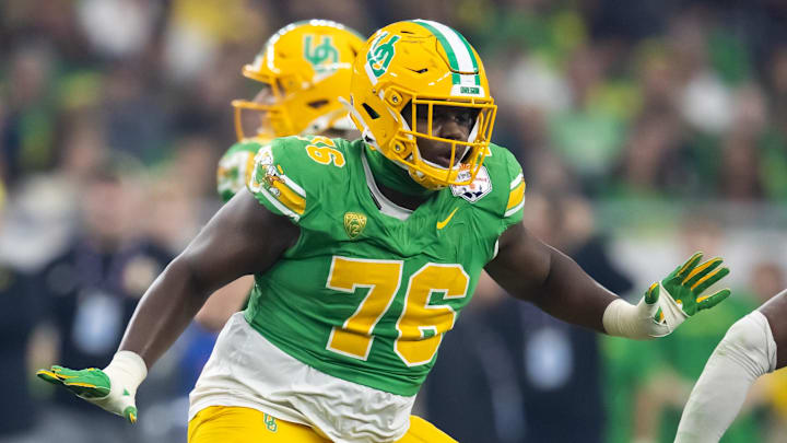 Jan 1, 2024; Glendale, AZ, USA; Oregon Ducks offensive lineman Josh Conerly Jr. (76) against the Liberty Flames during the 2024 Fiesta Bowl at State Farm Stadium.