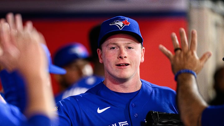 Apr 20, 2026; Anaheim, California, USA; Toronto Blue Jays pitcher Louis Varland (77) is greeted by teammates after a pitching change during the eighth inning against the Los Angeles Angels at Angel Stadium. Mandatory Credit: William Liang-Imagn Images