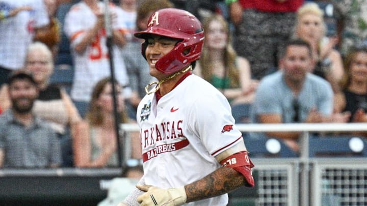 Arkansas Razorbacks shortstop Wehiwa Aloy (9) circles the bases after hitting a home run against the UCLA Bruins during the first inning at Charles Schwab Field. 