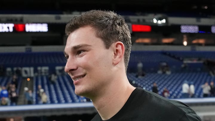 Feb 28, 2026; Indianapolis, IN, USA; Indiana quarterback Fernando Mendoza (QB11) looks on during the NFL Scouting Combine at Lucas Oil Stadium. Mandatory Credit: Kirby Lee-Imagn Images