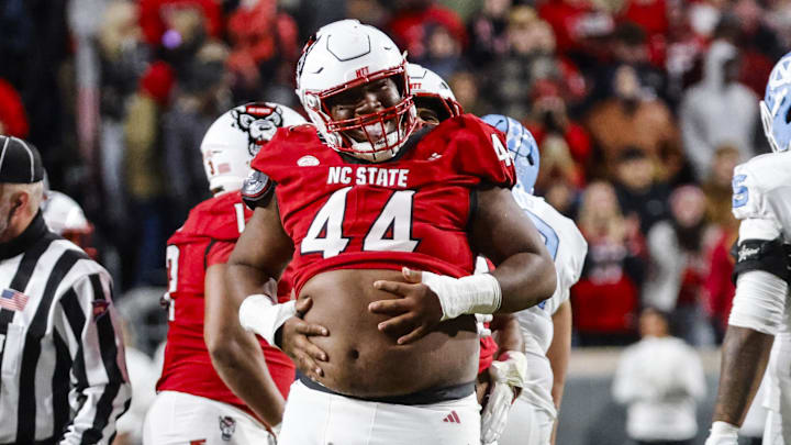 Nov 29, 2025; Raleigh, North Carolina, USA;  NC State Wolfpack defensive tackle Brandon Cleveland (44) reacts to his tackle during the first half of the game against the North Carolina Tar Heels at Carter-Finley Stadium.  Mandatory Credit: Jaylynn Nash-Imagn Images