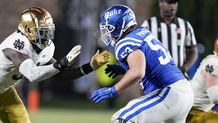 Sep 30, 2023; Durham, North Carolina, USA; Notre Dame Fighting Irish defensive lineman Nana Osafo-Mensah (31) against Duke Blue Devils offensive lineman Brian Parker II (53) during the second half at Wallace Wade Stadium. Mandatory Credit: Jim Dedmon-Imagn Images