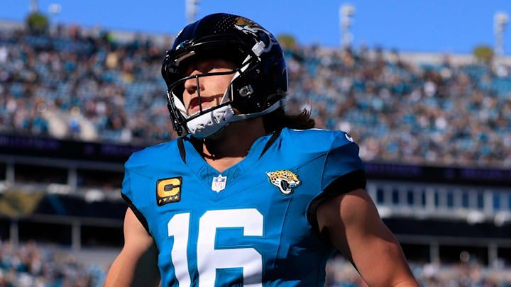 Jacksonville Jaguars quarterback Trevor Lawrence (16) scores a touchdown on a keeper during the first quarter of an NFL football matchup at EverBank Stadium, Sunday, Dec. 14, 2025, in Jacksonville, Fla. [Corey Perrine/Florida Times-Union]