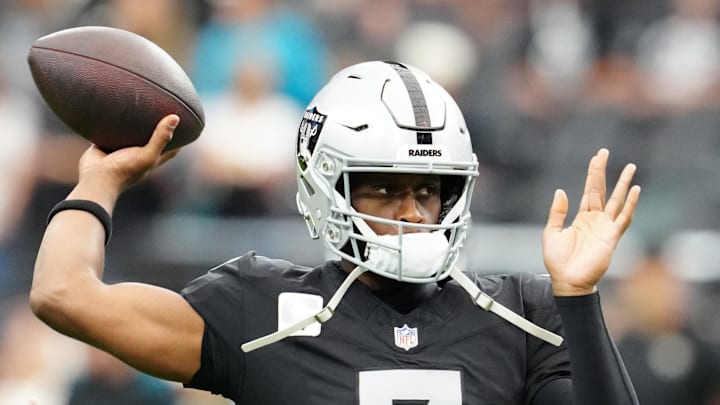 Nov 2, 2025; Paradise, Nevada, USA;  Las Vegas Raiders quarterback Geno Smith (7) warms up before the game against the Jacksonville Jaguars at Allegiant Stadium. Mandatory Credit: Stephen R. Sylvanie-Imagn Images