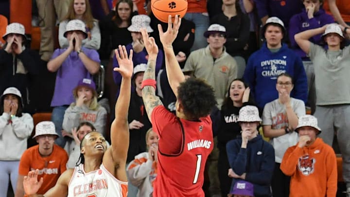 NC State Wolfpack forward Darrion Williams (1) shoots the ball past Clemson Tigers forward RJ Godfrey (0) with seven seconds left in the second half on Tuesday, Jan. 20, 2026, during the NCAA men’s basketball game at Littlejohn Coliseum in Clemson, South Carolina. NC State Wolfpack won 80-76 in OT.