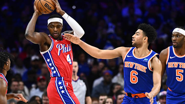 Jan 5, 2024; Philadelphia, Pennsylvania, USA; Philadelphia 76ers forward Paul Reed (44) controls the ball against New York Knicks guard Quentin Grimes (6) in the second quarter at Wells Fargo Center. Mandatory Credit: Kyle Ross-Imagn Images