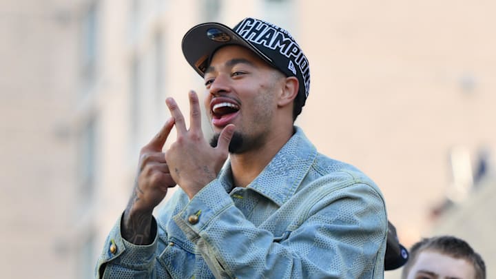 Feb 11, 2026; Seattle, WA, USA; Seattle Seahawks wide receiver Jaxon Smith-Njigba (11) interacts with fans during the Super Bowl LX World Champions parade in downtown Seattle.
