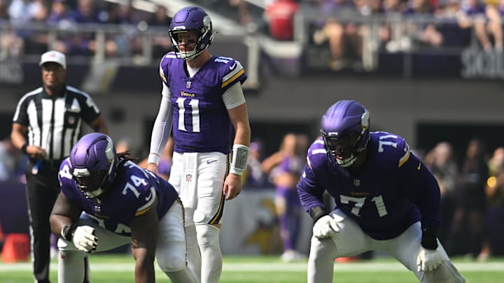 Sep 21, 2025; Minneapolis, Minnesota, USA; Minnesota Vikings quarterback Carson Wentz (11) walks up to the line of scrimmage during the first half against the Cincinnati Bengals at U.S. Bank Stadium.