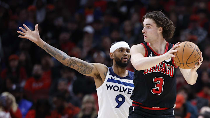 Nov 7, 2024; Chicago, Illinois, USA; Chicago Bulls guard Josh Giddey (3) looks to pass against Minnesota Timberwolves guard Nickeil Alexander-Walker (9) during the first half at United Center. Mandatory Credit: Kamil Krzaczynski-Imagn Images