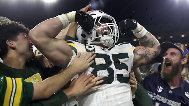Green Bay Packers tight end Tucker Kraft (85) celebrates a touchdown with fans against the Washington Commanders. Green Bay Packers tight end Tucker Kraft (85) celebrates a touchdown with fans against the Washington Commanders.