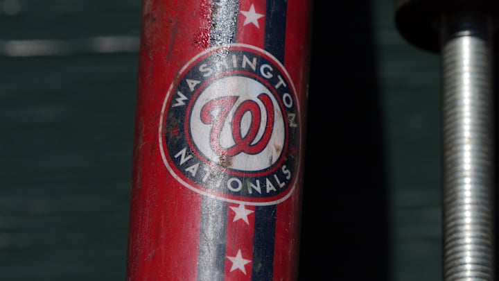 Aug 10, 2025; San Francisco, California, USA; The Washington Nationals logo appears on a fungo bat in the dugout before the game against the San Francisco Giants at Oracle Park.