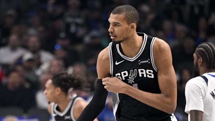 Feb 5, 2026; Dallas, Texas, USA; San Antonio Spurs forward Victor Wembanyama (1) celebrates making a 3-point basket against the Dallas Mavericks during the first quarter at the American Airlines Center.