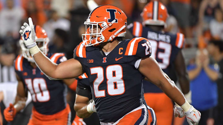 Aug 29, 2024; Champaign, Illinois, USA;  Illinois Fighting Illini linebacker Dylan Rosiek (28) reacts to a fumble recovery during the second half against the Easter Illinois Panthers  at Memorial Stadium. Mandatory Credit: Ron Johnson-Imagn Images