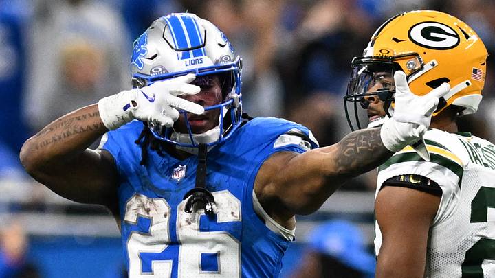 Detroit Lions running back Jahmyr Gibbs (26) celebrates in front of Packers cornerback Carrington Valentine in 2024.