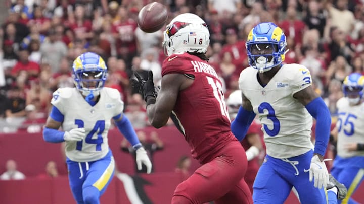 Arizona Cardinals wide receiver Marvin Harrison Jr. (18) catches a pass for a touchdown against the Los Angeles Rams during the first quarter at State Farm Stadium. Arizona Cardinals wide receiver Marvin Harrison Jr. (18) catches a pass for a touchdown against the Los Angeles Rams during the first quarter at State Farm Stadium.