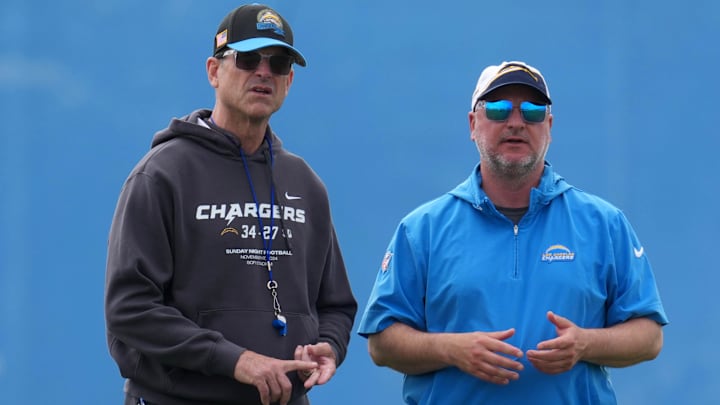 May 12, 2025; El Segundo, CA, USA; Los Angeles Chargers coach Jim Harbaugh (left) and general manager Joe Hortiz watch during offseason workouts at The Bolt. Mandatory Credit: Kirby Lee-Imagn Images