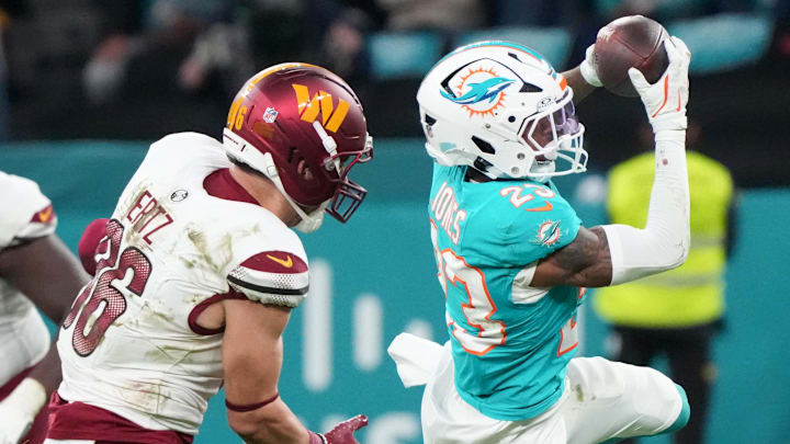 Nov 16, 2025; Madrid, Spain; Miami Dolphins cornerback Jack Jones (23) interception a pass intended for Washington Commanders tight end Zach Ertz (86) in overtime during the 2025 NFL Madrid Game at Santiago Bernabeu Stadium. Mandatory Credit: Kirby Lee-Imagn Images