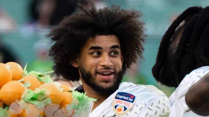 Oregon Ducks College Football Playoff matchup Big Ten Dante Moore quarterback NFL Draft New York Jets mock draft projection 