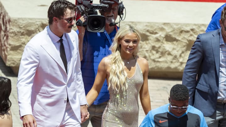 National League pitcher Paul Skenes of the Pittsburgh Pirates walks the red carpet with his girlfriend LSU gymnast Olivia Livvy Dunne before the 2024 MLB All-Star game at Globe Life Field. 