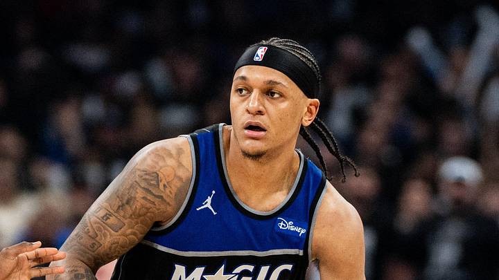 Orlando Magic forward Paolo Banchero dribbles the ball against Detroit Pistons forward Paul Reed. Orlando Magic forward Paolo Banchero dribbles the ball against Detroit Pistons forward Paul Reed.