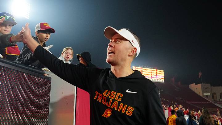 Southern California Trojans head coach Lincoln Riley celebrates with fans after the game against the UCLA Bruins at United Airlines Field at Los Angeles Memorial Coliseum. Southern California Trojans head coach Lincoln Riley celebrates with fans after the game against the UCLA Bruins at United Airlines Field at Los Angeles Memorial Coliseum.