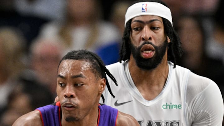 Toronto Raptors forward Scottie Barnes looks to move the ball past Dallas Mavericks forward Anthony Davis. Toronto Raptors forward Scottie Barnes looks to move the ball past Dallas Mavericks forward Anthony Davis.