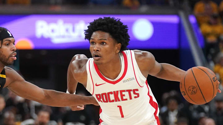 May 2, 2025; San Francisco, California, USA; Houston Rockets forward Amen Thompson (1) dribbles past Golden State Warriors guard Buddy Hield (7) in the second quarter of game six of the first round for the 2025 NBA Playoffs at Chase Center. Mandatory Credit: Cary Edmondson-Imagn Images