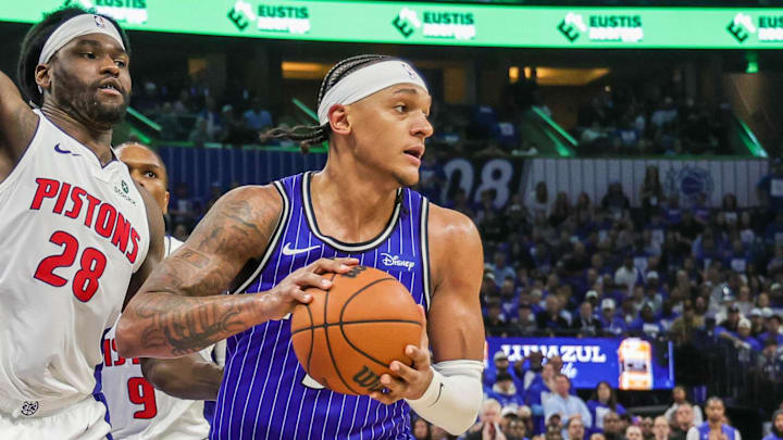 Apr 27, 2026; Orlando, Florida, USA; Orlando Magic forward Paolo Banchero (5) looks to pass in front of Detroit Pistons forward Isaiah Stewart (28) during the second half during game four of the first round of the 2026 NBA Playoffs at Kia Center. Mandatory Credit: Mike Watters-Imagn Images