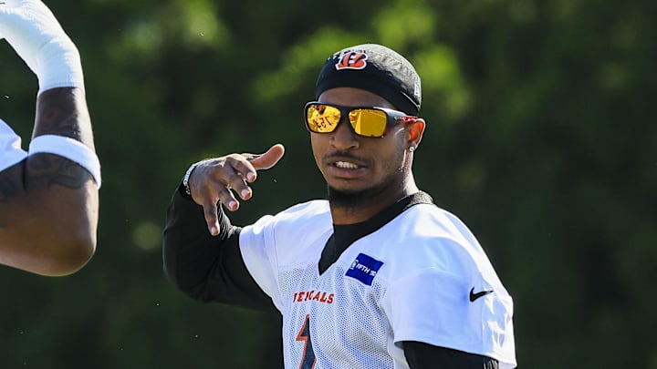 Jul 23, 2025; Cincinnati, OH, USA; Cincinnati Bengals wide receiver Ja'Marr Chase (1) and offensive tackle Orlando Brown Jr. (75) during training camp at Kettering Health Practice Field. Mandatory Credit: Katie Stratman-Imagn Images