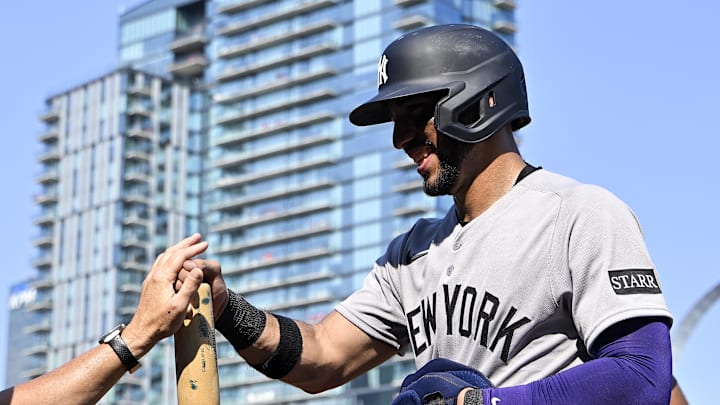 Aug 17, 2025; St. Louis, Missouri, USA;  New York Yankees shortstop Jose Caballero (72) is congratulated by manager Aaron Boone (17) after scoring against the St. Louis Cardinals during the ninth inning at Busch Stadium. Mandatory Credit: Jeff Curry-Imagn Images