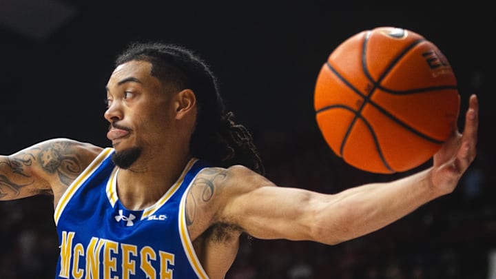 Nov 11, 2024; Tuscaloosa, Alabama, USA; McNeese State Cowboys guard Alyn Breed (7) goes to pass against the Alabama Crimson Tide during the first half at Coleman Coliseum. Mandatory Credit: Will McLelland-Imagn Images Nov 11, 2024; Tuscaloosa, Alabama, USA; McNeese State Cowboys guard Alyn Breed (7) goes to pass against the Alabama Crimson Tide during the first half at Coleman Coliseum. Mandatory Credit: Will McLelland-Imagn Images