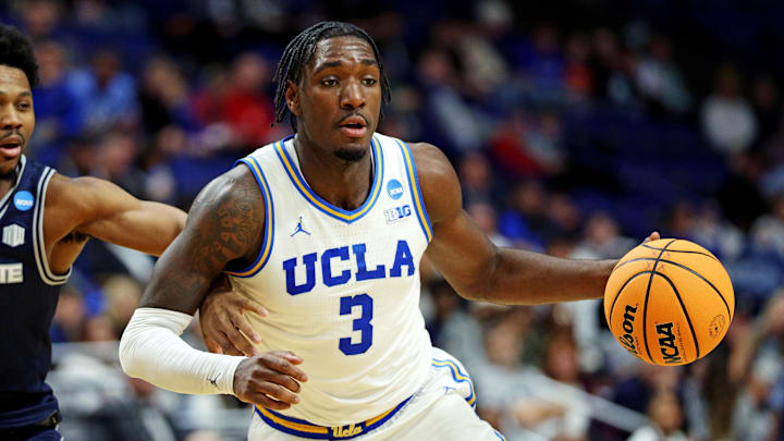 Mar 20, 2025; Lexington, KY, USA; UCLA Bruins guard Eric Dailey Jr. (3) drives to the basket against Utah State Aggies guard Dexter Akanno (7) during the second half in the first round of the NCAA Tournament at Rupp Arena. Mandatory Credit: Jordan Prather-Imagn Images Mar 20, 2025; Lexington, KY, USA; UCLA Bruins guard Eric Dailey Jr. (3) drives to the basket against Utah State Aggies guard Dexter Akanno (7) during the second half in the first round of the NCAA Tournament at Rupp Arena. Mandatory Credit: Jordan Prather-Imagn Images
