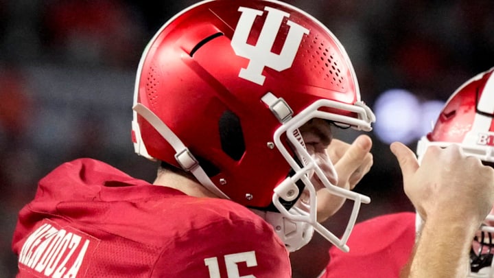 Indiana Hoosiers quarterback Fernando Mendoza (15) celebrates with his teammates after rushing for a touchdown Monday, Jan. 19, 2026, during the College Football Playoff National Championship college football game at Hard Rock Stadium in Miami Gardens.