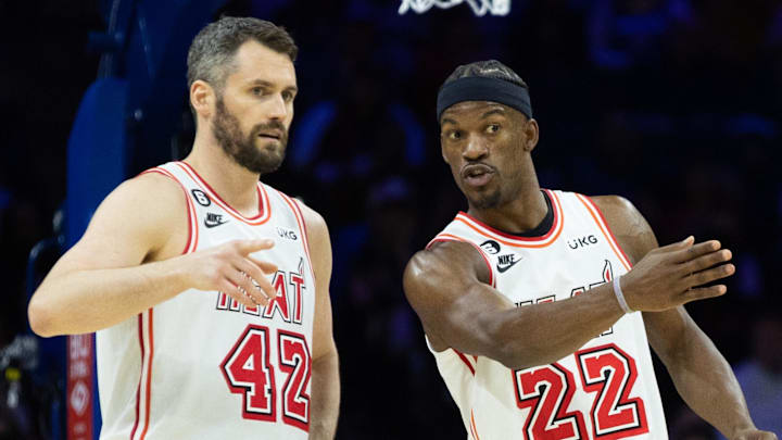 Feb 27, 2023; Philadelphia, Pennsylvania, USA; Miami Heat forward Jimmy Butler (22) talks with forward Kevin Love (42) during a break in action in the second quarter against the Philadelphia 76ers at Wells Fargo Center. Mandatory Credit: Bill Streicher-Imagn Images Feb 27, 2023; Philadelphia, Pennsylvania, USA; Miami Heat forward Jimmy Butler (22) talks with forward Kevin Love (42) during a break in action in the second quarter against the Philadelphia 76ers at Wells Fargo Center. Mandatory Credit: Bill Streicher-Imagn Images