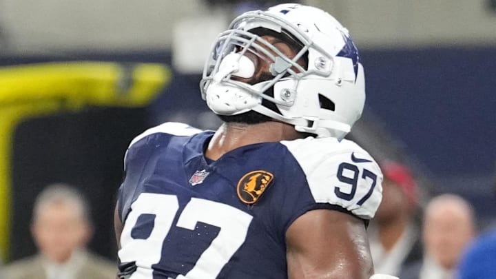 Nov 28, 2024; Arlington, Texas, USA;  Dallas Cowboys defensive tackle Osa Odighizuwa (97) celebrates after a sack against the New York Giants during the second half at AT&T Stadium. Mandatory Credit: Chris Jones-Imagn Images