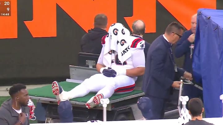 Patriots offensive tackle Will Campbell was carted off the field.