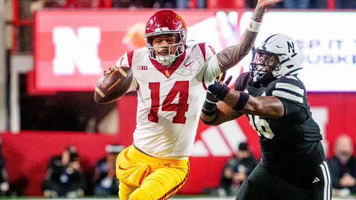 Southern California Trojans quarterback Jayden Maiava runs against Nebraska Cornhuskers defensive lineman Elijah Jeudy during the second quarter at Memorial Stadium.