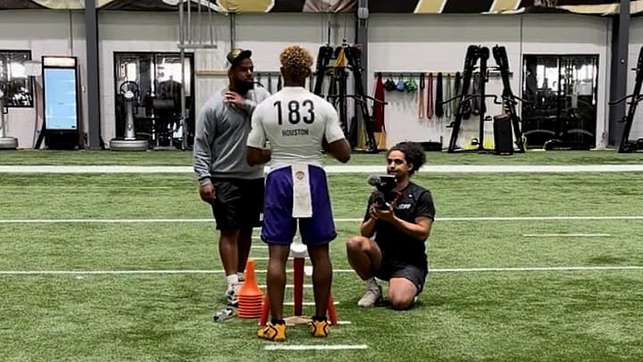 2027 Quarterback Peyton Houston listens to instruction at New Orleans Elite 11 Regional.