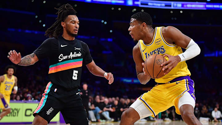 Feb 10, 2026; Los Angeles, California, USA; Los Angeles Lakers forward Rui Hachimura (28) controls the ball against San Antonio Spurs guard Stephon Castle (5) during the first half at Crypto.com Arena.
