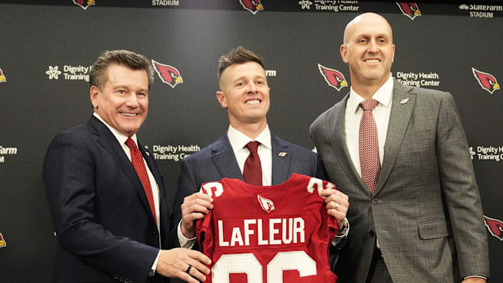 Arizona Cardinals president Michael Bidwill, new head coach Mike LaFleur, and general manager Monti Ossenfort pose for a photograph on Feb. 3, 2026, at Arizona Cardinals training center in Tempe.