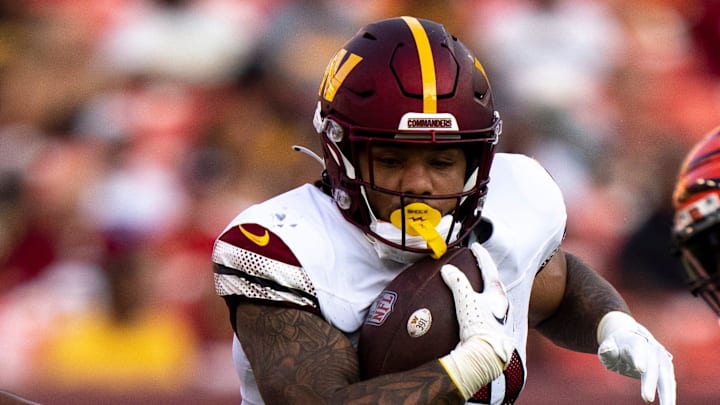 Washington Commanders running back Chris Rodriguez Jr. (23) runs with the ball in the second quarter of the NFL preseason week 3 game between the Cincinnati Bengals and the Washington Commanders at FedEx Field in Landover, M.D., on Saturday, Aug. 26, 2023.