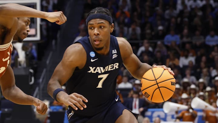 Mar 19, 2025; Dayton, OH, USA; Xavier Musketeers guard Ryan Conwell (7) dribbles the ball defended by Texas Longhorns guard Tramon Mark (12) in the second half at UD Arena. Mandatory Credit: Rick Osentoski-Imagn Images Mar 19, 2025; Dayton, OH, USA; Xavier Musketeers guard Ryan Conwell (7) dribbles the ball defended by Texas Longhorns guard Tramon Mark (12) in the second half at UD Arena. Mandatory Credit: Rick Osentoski-Imagn Images