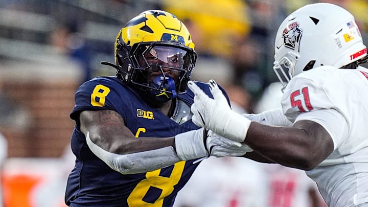 Former Michigan edge Derrick Moore (8) goes against New Mexico offensive lineman Malik Aliane (51) Former Michigan edge Derrick Moore (8) goes against New Mexico offensive lineman Malik Aliane (51)